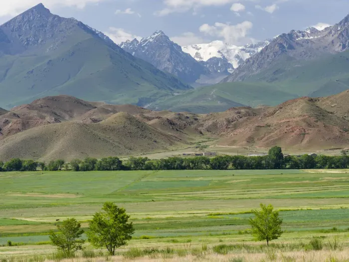 Framed Print : Agriculture near lake Issyk-Kul. Tien Shan mountains or heavenly mountains in Kirghizia