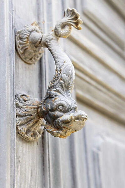 Aigues-Mortes, Gard, Occitania, France. Old door knocker in the shape of a fish