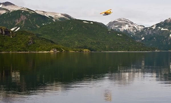 Alaska. Katmai NP. A DeHavilland Beaver takes off from Kinak Bay, with Hidden Harbor