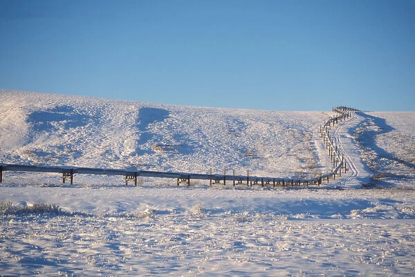Alaskan pipeline on the snowy tundra of the North Slope of the Brooks Range, central