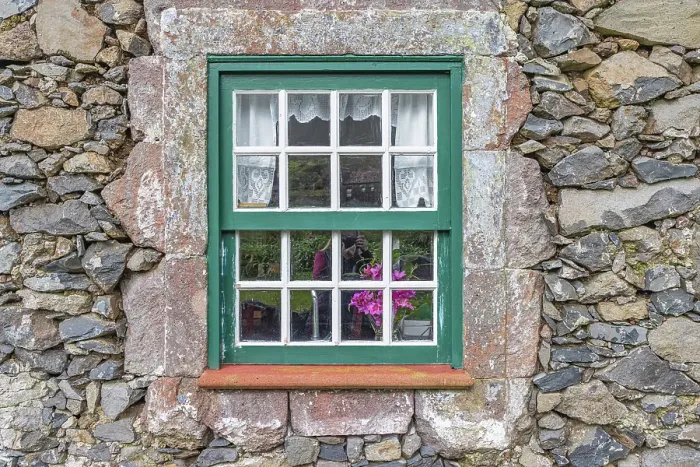Framed Print : Aldeia da Cuada, Flores, Azores, Portugal. Paned window on a stone building