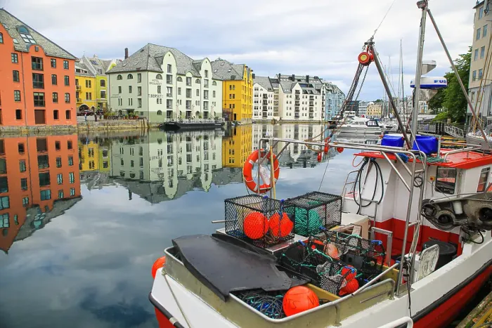 Framed Print : Alesund, Norway. Fishing boat and canal water reflection