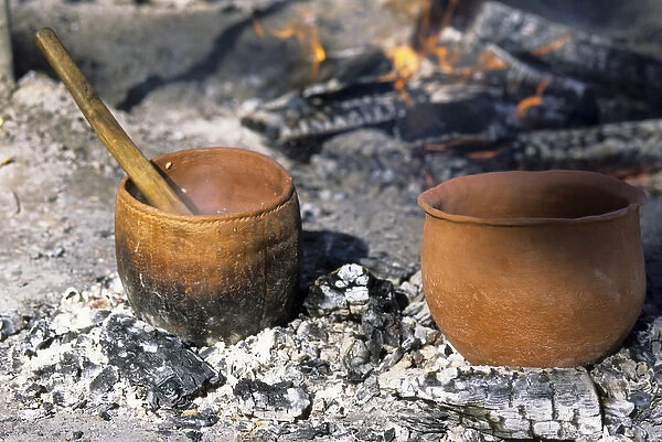 Algonkin Indians cooked their meals over open fires using spits and clay cooking pots
