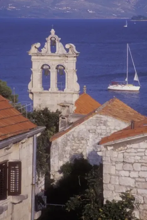 Framed Print : All Saints Church (Svi Sveti) with a sailboat in the background. Korcula Island. Croatia Framed Print : All Saints Church (Svi Sveti) with a sailboat in the background. Korcula Island. Croatia