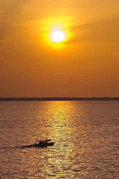 Amazon River, Brazil. Fishermen at sunset