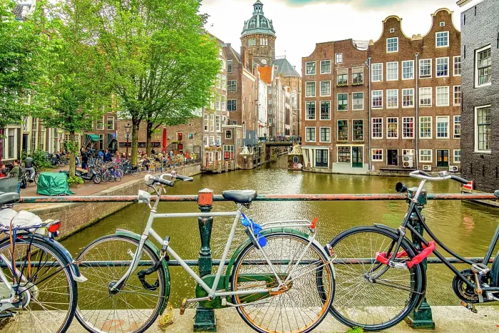 Framed Print : Amsterdam, Netherlands. Wide angle landscape view of two canals merging to form a corner for historical buildings