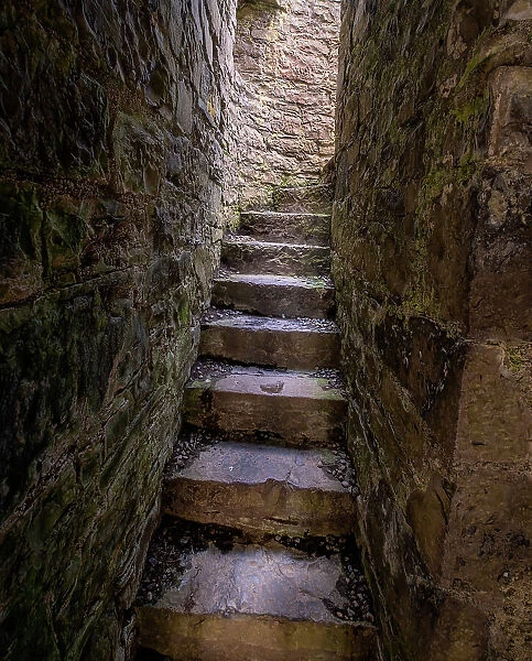 Ancient steps lead to a roofless second floor room