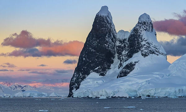 Antarctic Peninsula, Antarctica, Lemaire Channel. Una Peaks at sunset