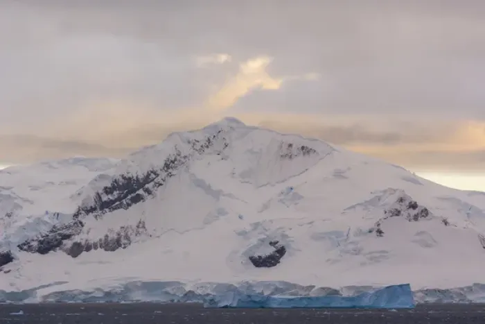 Framed Print : Antarctica. Antarctic Peninsula. Paradise Harbor. Snowy mountains and clouds at sunrise