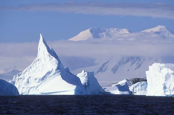 Antarctica, Boothe Island, Afternoon sun lights icebergs grounded near Port Charcot