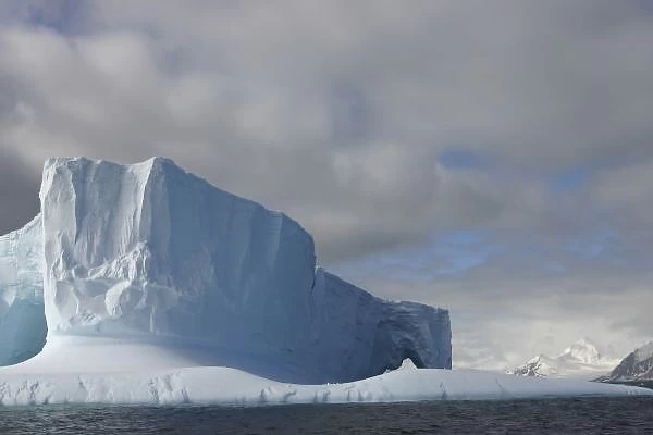 Antarctica, Bransfield Strait, Afternoon sun lights massive tabular iceberg near