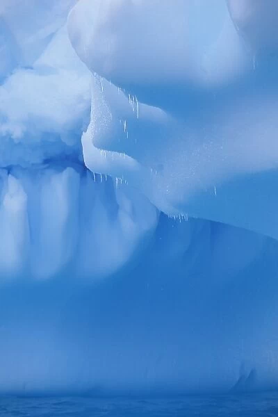 Antarctica, Petermann Island, Deep blue iceberg floating in Argentine Islands group