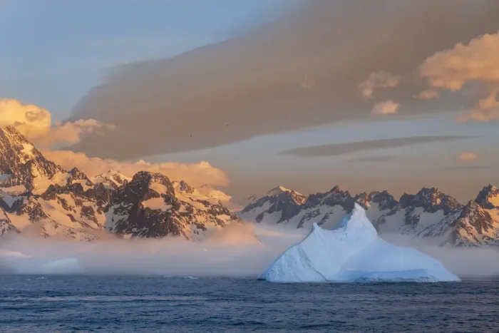 Framed Print : Antarctica, South Georgia Island, Coopers Bay. Iceberg and mountains at sunrise