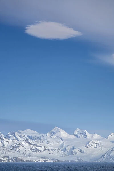 Antarctica, South Georgia Island. High winds create lenticular cloud