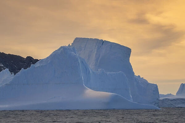 Antarctica, South Georgia Island, Coopers Bay. Iceberg at sunrise