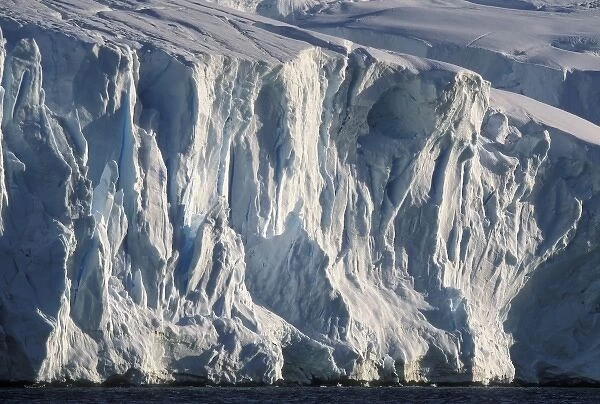 Antarctica, Wiencke Island, Afternoon sun lights blue ice face of tidewater glaciers