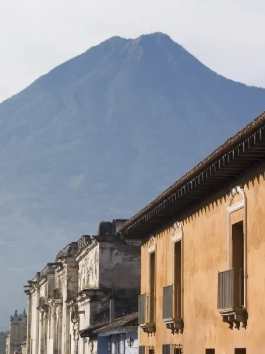 Framed Print : Antigua, Guatemala Building facades and nearby vocano