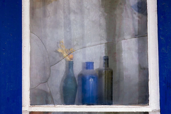 Antique colored bottles in window, Motherlode Country, Sierras, California