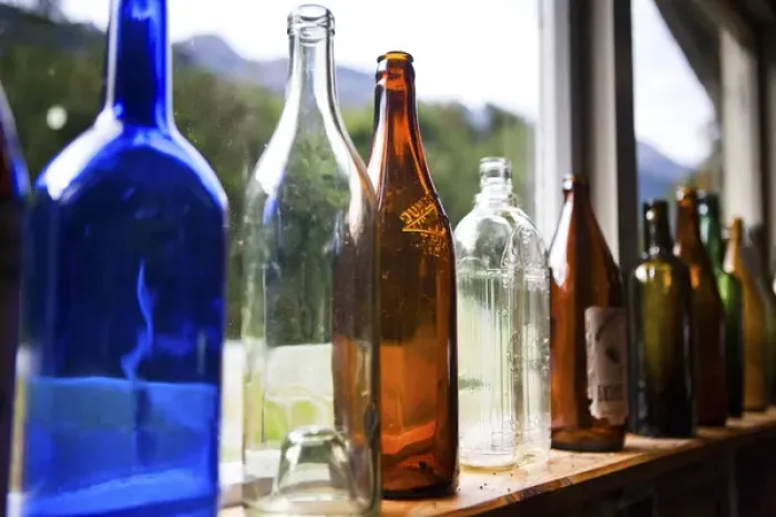 Framed Print : Antique glass bottles line the windowsill of a building, Gunns Camp, Hollyford Valley Framed Print : Antique glass bottles line the windowsill of a building, Gunns Camp, Hollyford Valley