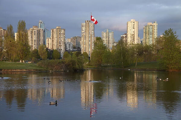 Apartments reflected in Vanier Park Pond, Vancouver, British Columbia, Canada