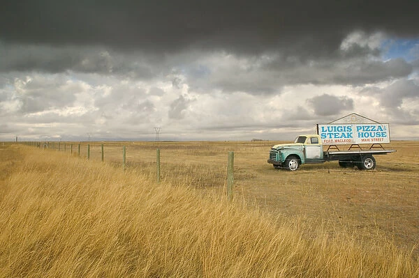 02. Canada, Alberta, Fort MacLeod: Approaching Storm & Truck Sign for Luigis Pizza