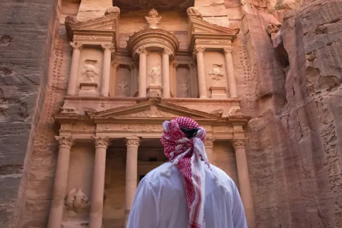 Framed Print : Arab man watching Facade of Treasury (Al Khazneh), Petra, Jordan (UNESCO World Heritage