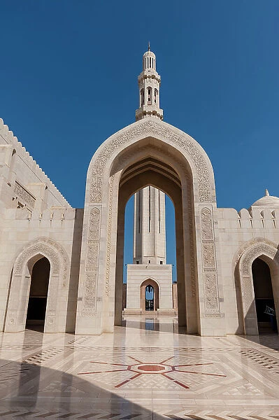 An archway leading to a minaret in Sultan Qaboos Grand Mosque, Muscat, Oman
