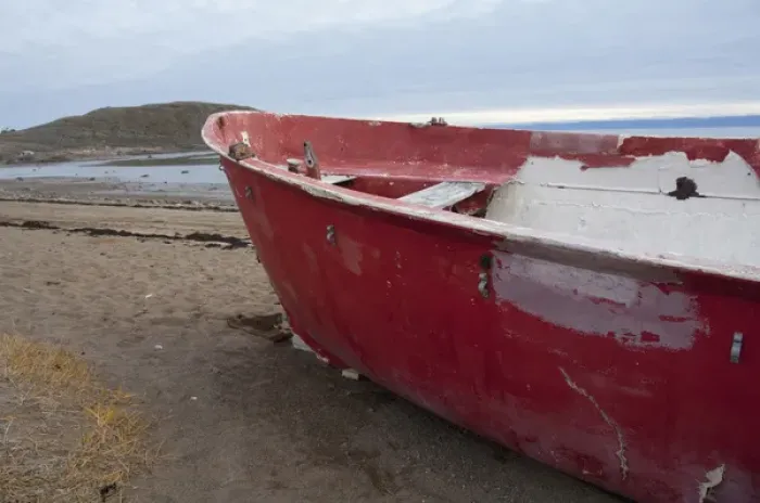 Framed Print : Arctic Canada, Nunavut, Baffin Island, Iqaluit (aka Frobisher Bay). Red boat on beach