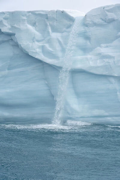 Arctic, Svalbard, Nordaustlandet Island. Waterfalls cascading from the melting glacier