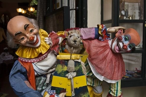 Argentina, Buenos Aires. San Telmo neighborhood: Toy clown, Pasaje de la Defensa shopping arcade