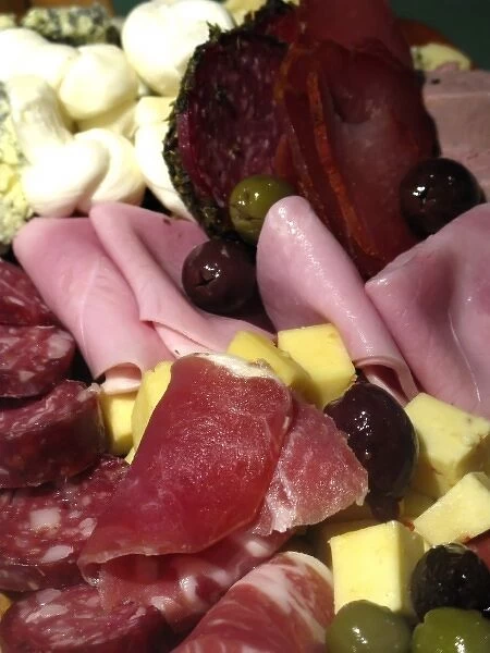 Argentina, Buenos Aires. Typical Argentine antipasto with cheeses, salami, ham, olives