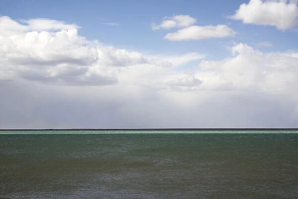 Argentina, Santa Cruz. Puerto Santa Cruz, river Santa Cruz under stormy clouds