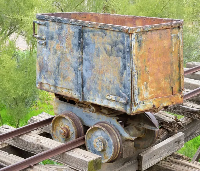 Framed Print : Arizona. Old gold mining ore carrier, detail showing the wheels and rail tracks