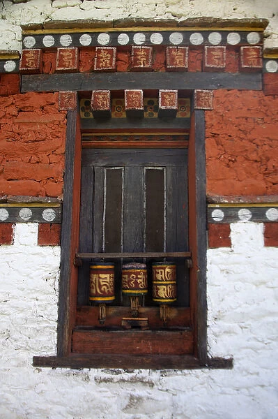 Asia, Bhutan, Bumthang. Prayer wheels at Jambay Lhakhang, a Buddhist temple dating