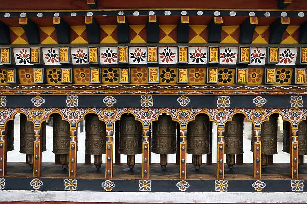 Asia, Bhutan, Thimpu. Prayer Wheels in a small public square in central Thimpu