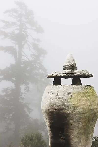 Asia, Bhutan. Urn placed as decoration at the pass of Dochum La on the road between Pinakha
