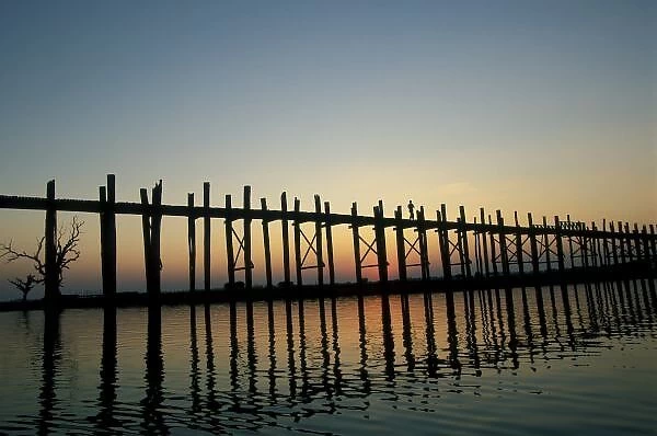 Asia, Burma (Myanmar) Silhouette of U Biens Bridge on Lake Taungthaman at sunset