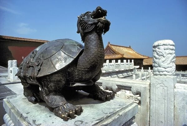 Asia, China, Beijing. A metal statue of a turtle sits on a baluster cap in the Forbidden City