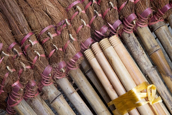 Asia, China, Hong Kong. A display of handmade straw dust brooms for sale
