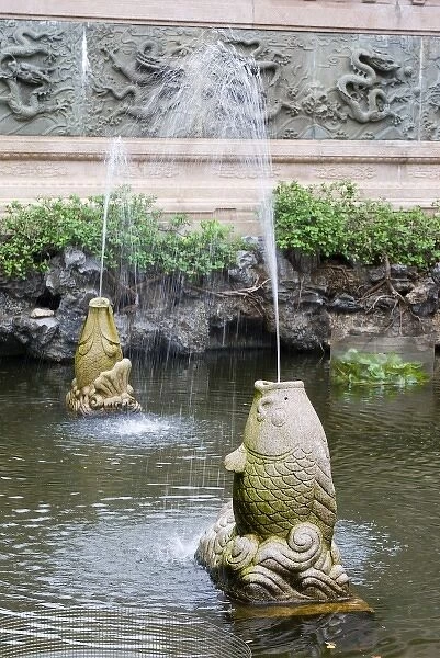Asia, China, Hong Kong, Kowloon, Wong Tai Sin district. Stone carved carp fountains