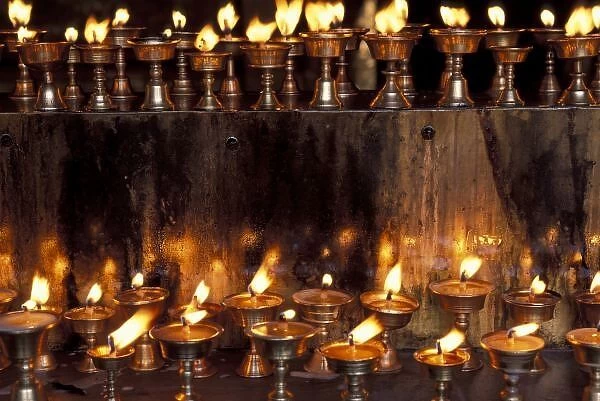 Asia, China, Tibet, Lhasa. Prayer flames, Jokhong Temple