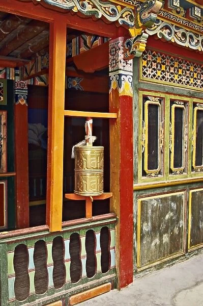 Asia, China, Yunnan, Deqin. Prayer wheel in Tibetan family house at Shangqiatou Village