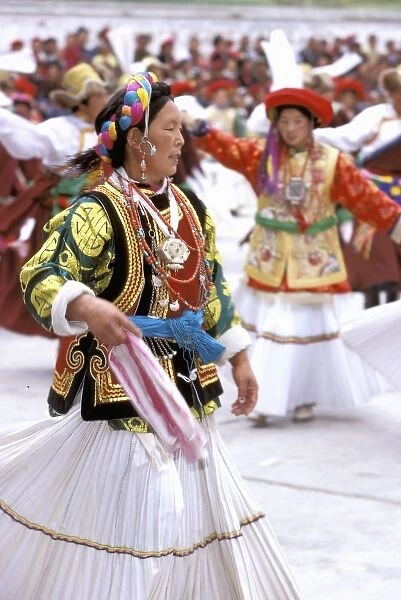 Asia, China, Yunnan Province, Diqing Prefecture, Benzilan village. Costumed Tibetan dance