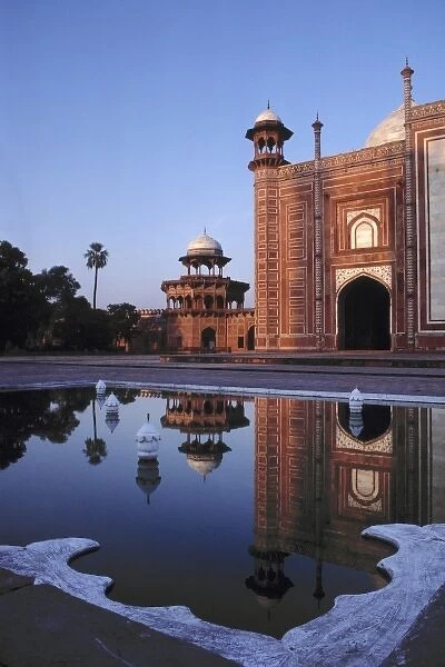Asia, India, Agra. A mosque is reflected in a still pool in the Taj Mahal Complex