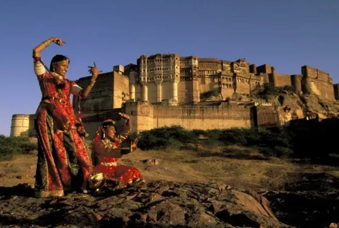 Framed Print : Asia, India, Jodhpur. Two women dancing in front of Meherangarh Fort. MR