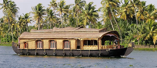 Asia, India, Kerala (Backwaters). A Kerala houseboat on Kumarakom Lake