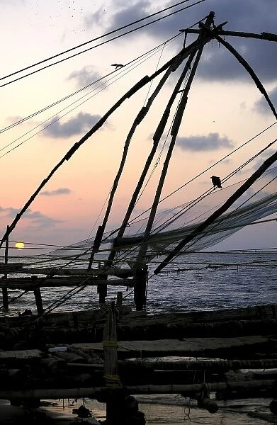 Asia, India, Kerala, Kochi (Cochin). A silhouette of a Chinese fishing net