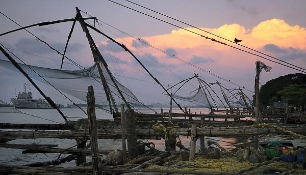 Asia, India, Kerala, Kochi (Cochin). A semi-silhouette of a Chinese fishing net