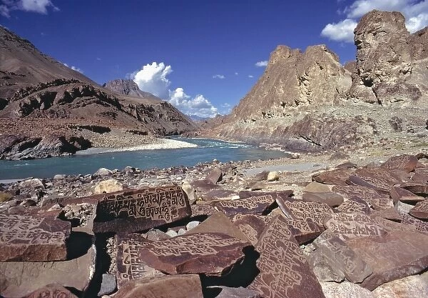 Asia, India, Ladakh, Zanskar River. Mani stones cover the banks of the Zanskar River, Ladakh, India