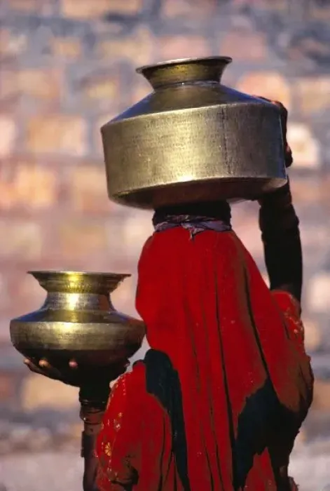 Framed Print : Asia, India, Rajasthan. A local woman in a red sari skillfully balances brass water Framed Print : Asia, India, Rajasthan. A local woman in a red sari skillfully balances brass water